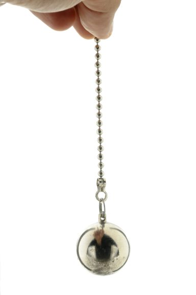 A silver ball on a chain to indicate the rhythmic swing to induce trance in hypnotherapy